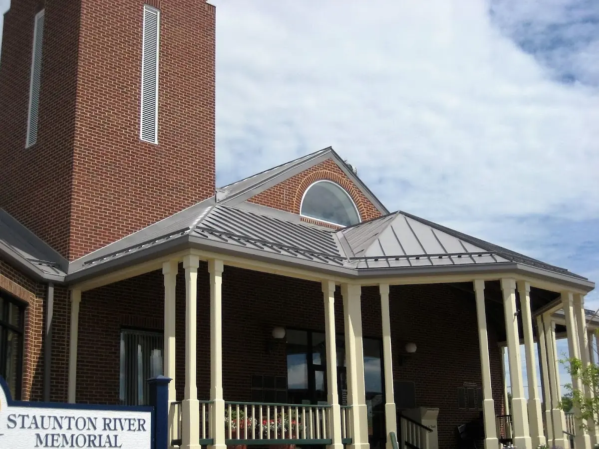 Skilled roofing craftsmen working on a residential roof in Riverbend